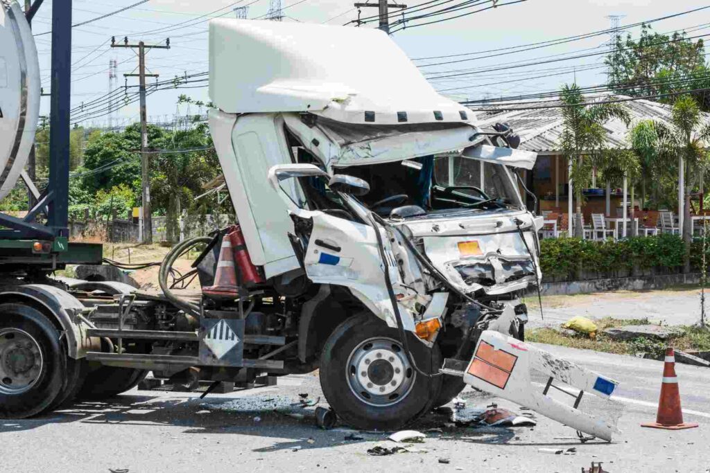 A damaged truck in the middle of the highway