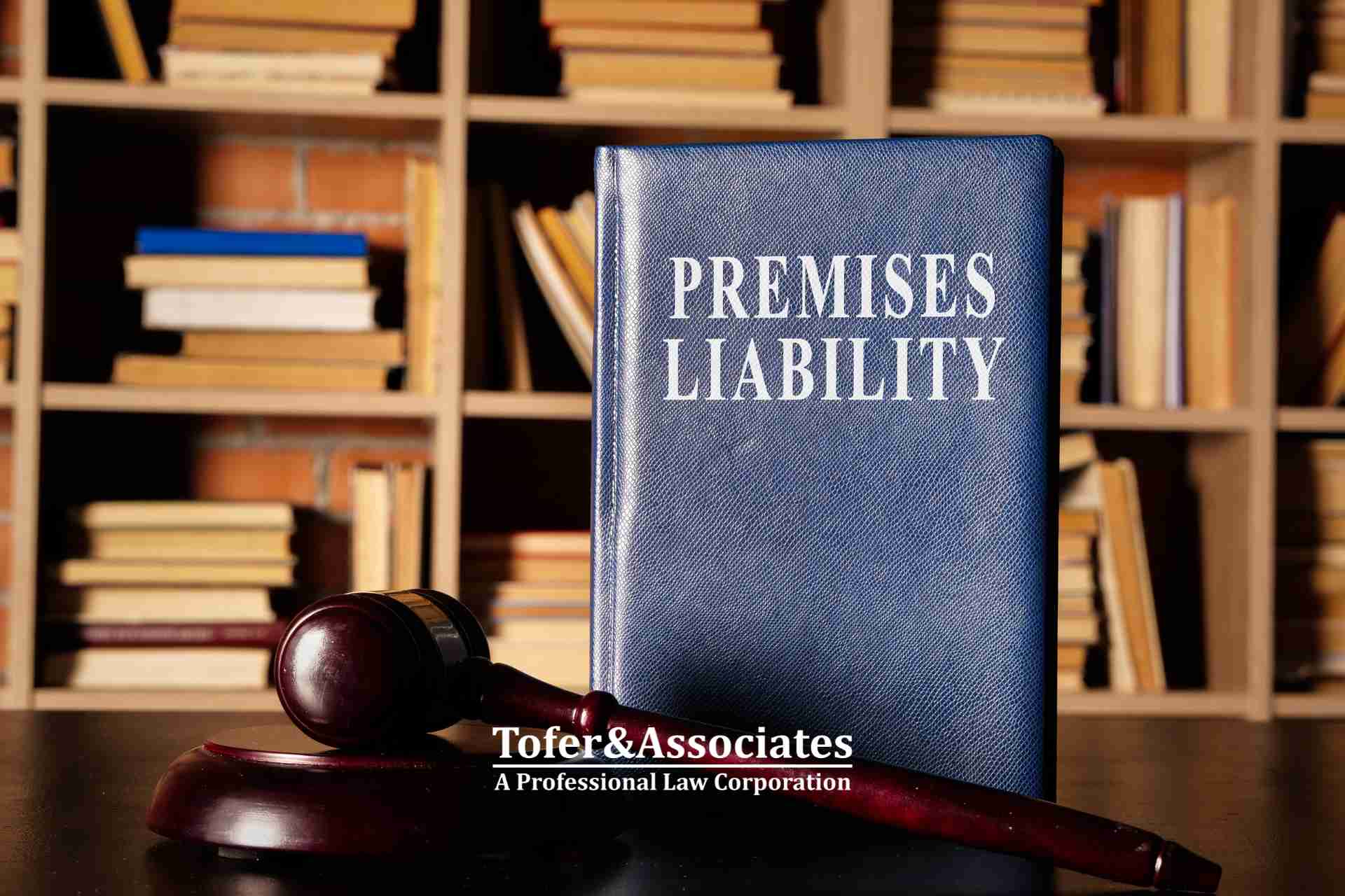 Premises liability law book with gavel - Tofer & Associates, California Premises Liability Attorney