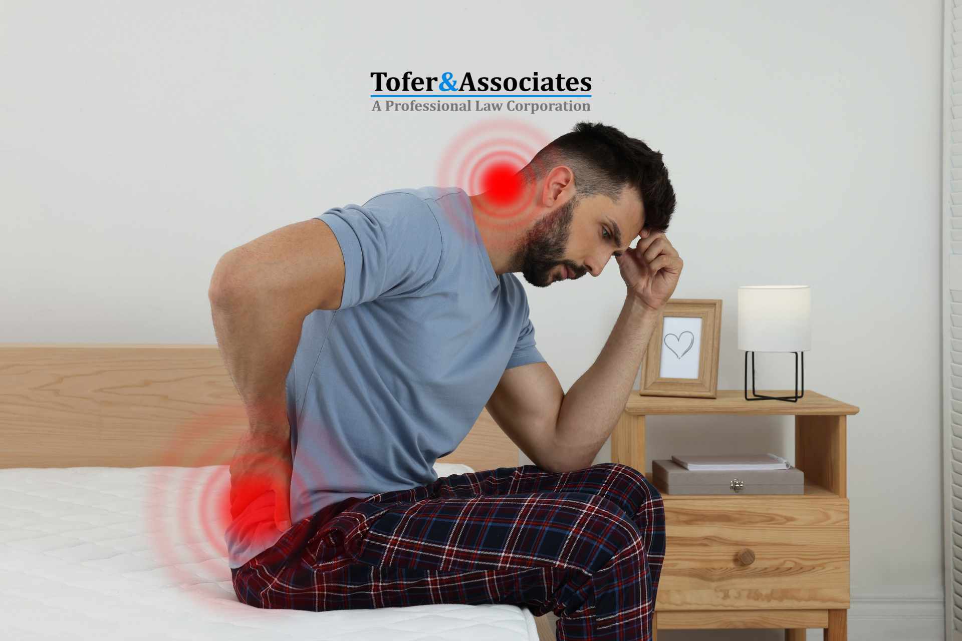 Man sitting on the edge of a bed, holding his lower back in pain, highlighting pain points on his neck and lower back