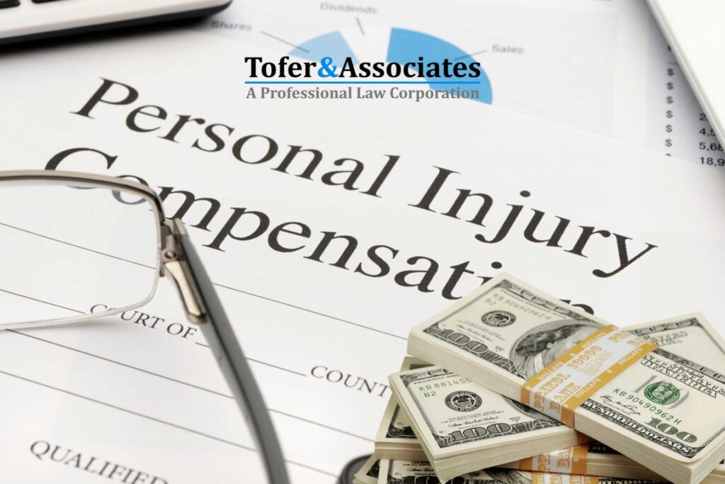 A personal injury compensation document with glasses and a stack of hundred-dollar bills