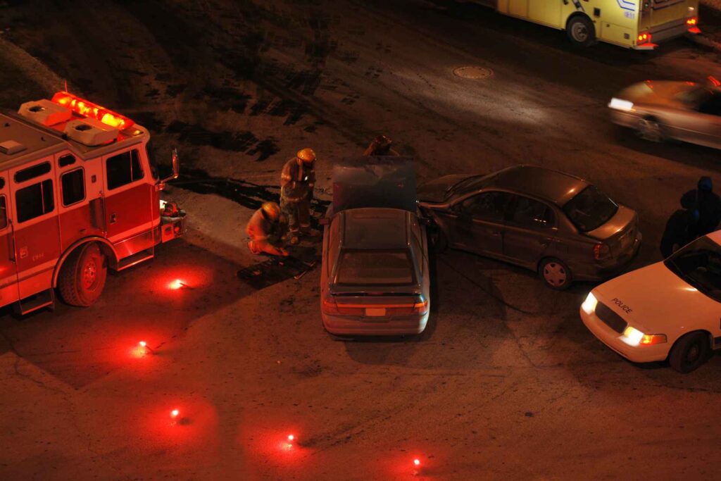 Emergency responders at the scene of a hallowen car accident