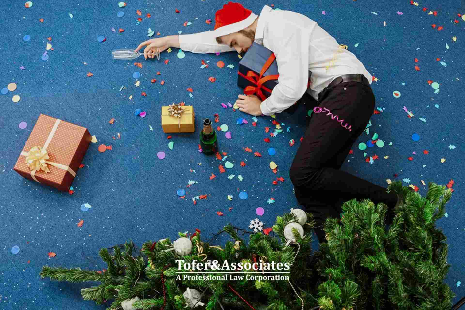 Holiday party accident with fallen Christmas tree and injured person, illustrating common holiday injuries.
